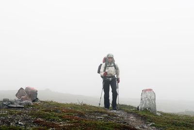 Man hiking in fog