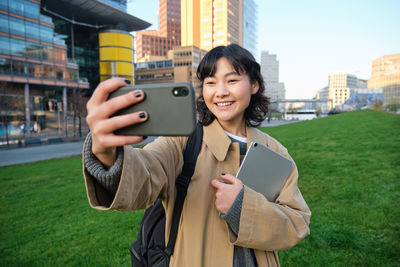 Young woman using mobile phone