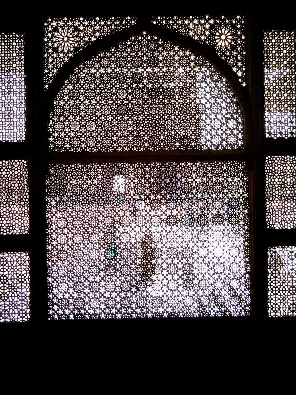 SHADOW OF WINDOW ON TILED FLOOR