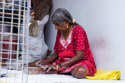 Woman working in traditional clothing