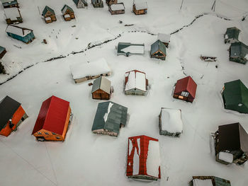 High angle view of snow covered roof on field