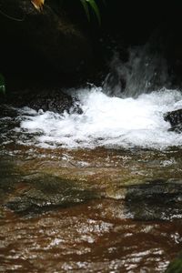 Close-up of water splashing in sea