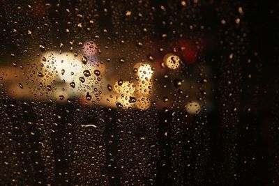 Close-up of raindrops on glass window