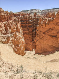 Rock formations on landscape against sky