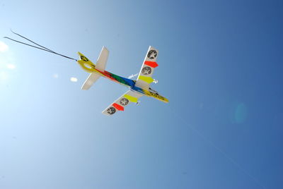 Low angle view of airplane flying in sky