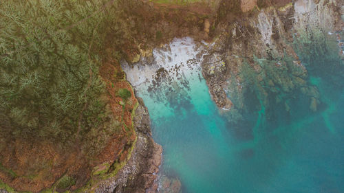 High angle view of water flowing through rocks