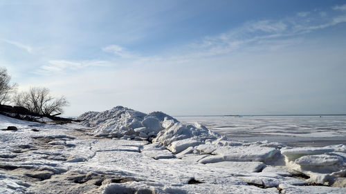 Scenic view of sea against sky during winter