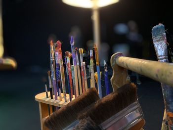 Close-up of paintbrushes in container