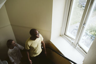 Couple looking through window