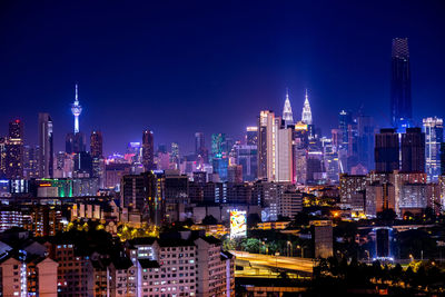 Illuminated buildings in city at night