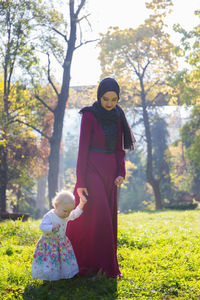 Full length of woman standing on field