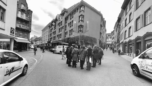 Panoramic view of people on street in city