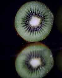 Close-up of lemon slice over black background