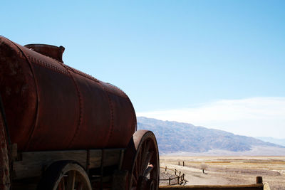 Scenic view of field against clear blue sky