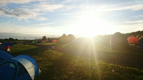 People on landscape against sky