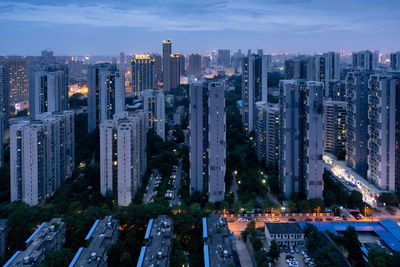 High angle view of buildings in city against sky