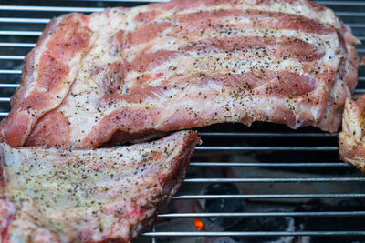 Close-up of meat on barbecue grill