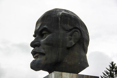 Low angle view of statue against sky