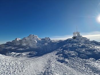 Scenic view of snowcapped mountains against clear sky