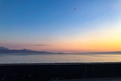 Scenic view of sea against sky during sunset