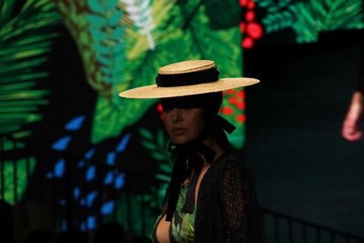 Portrait of young woman wearing hat