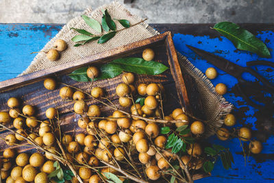 High angle view of longans in container on table