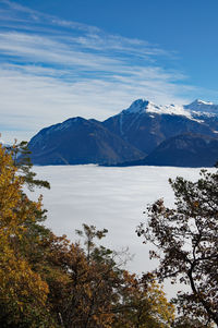 Scenic view of cloudscape and mountains against sky