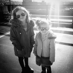 Rear view of women wearing sunglasses