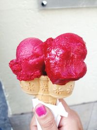 Cropped image of hand holding ice cream