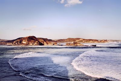 Scenic view of beach against sky