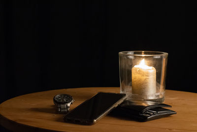 Close-up of tea light candle on table