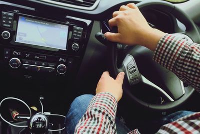 Close-up of woman driving car