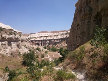 Scenic view of mountains against blue sky