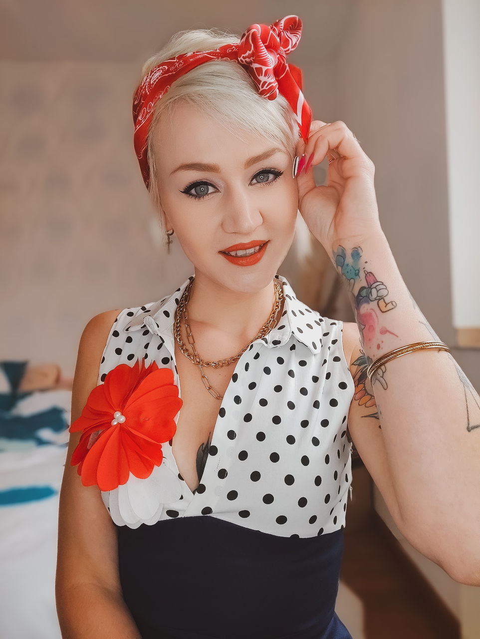 women, one person, portrait, fashion, adult, young adult, looking at camera, indoors, clothing, red, make-up, female, jewelry, pink, lifestyles, elegance, hairstyle, glamour, smiling, front view, arts culture and entertainment, happiness, tattoo, fashion accessory, waist up, emotion, dress, blond hair, pattern, individuality, lipstick, cool attitude