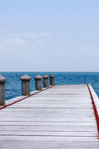 Pier over sea against sky