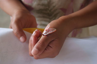 Close-up of moth on hand