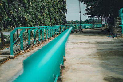 Empty swimming pool against trees