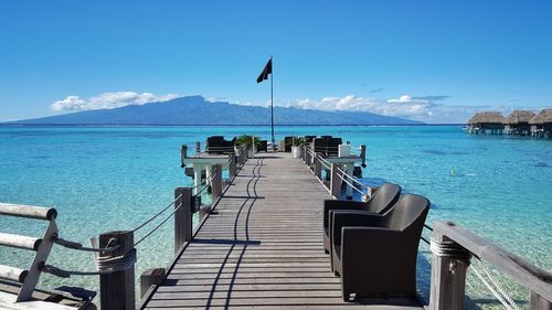 Seats on pier over sea at hotel sofitel moorea ia ora beach resort