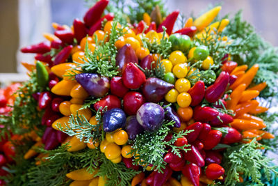 Autumn bouquet of colorful mini-peppers and greens.