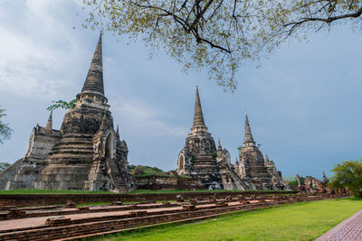 View of old temple building against sky