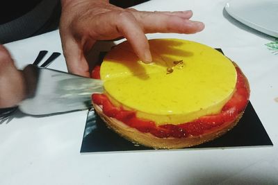 Close-up of cropped hand holding ice cream