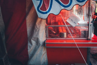 Rear view of man working on red tray