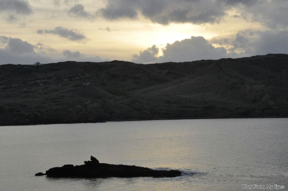 water, mountain, silhouette, sky, scenics, tranquil scene, tranquility, beauty in nature, sunset, waterfront, nature, sea, cloud - sky, mountain range, nautical vessel, idyllic, rock - object, transportation, boat, lake