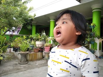 Portrait of cute boy looking away