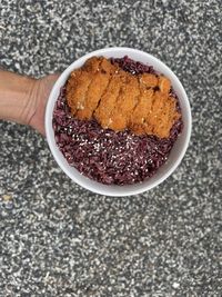 High angle view of hand holding ice cream