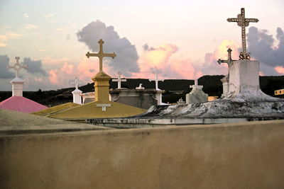 Crosses in cemetery at sunset