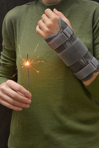 Close-up of man hand on table