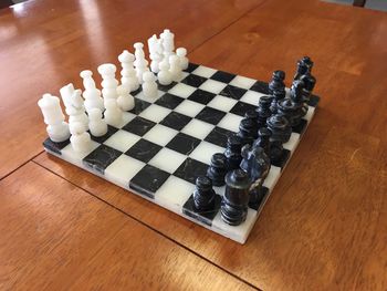 High angle view of chess pieces on table