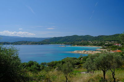 Scenic view of sea against blue sky