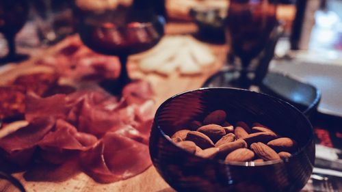 Close-up of almonds in glass on table